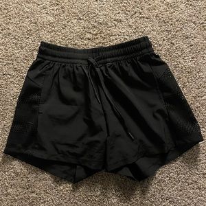Black Halara shorts new without tags, side pockets and built in liner